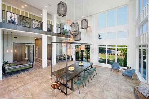 Gathering tables and loungers within the clubhouse at The Barrett, Georgia